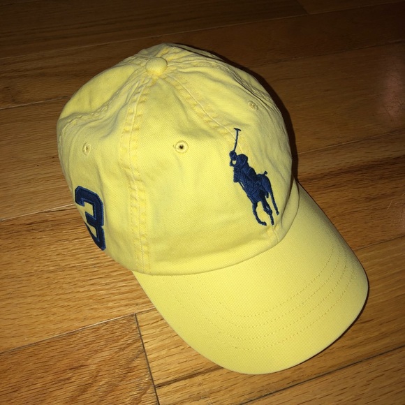black and yellow polo hat
